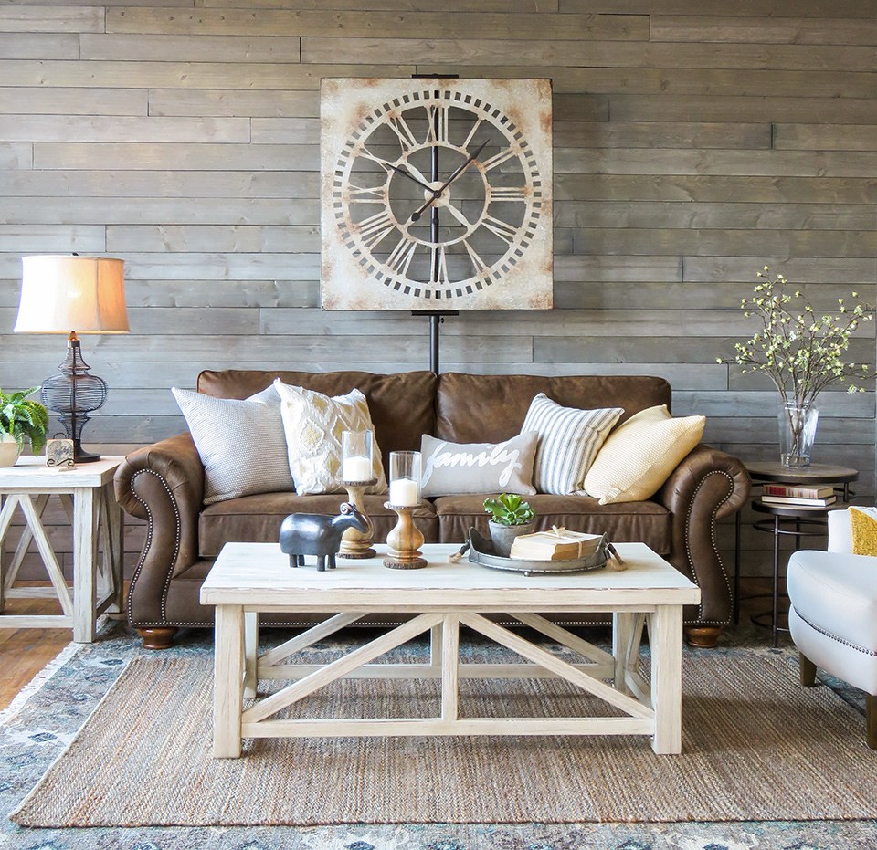Farmhouse living room with brown sofa and great styling