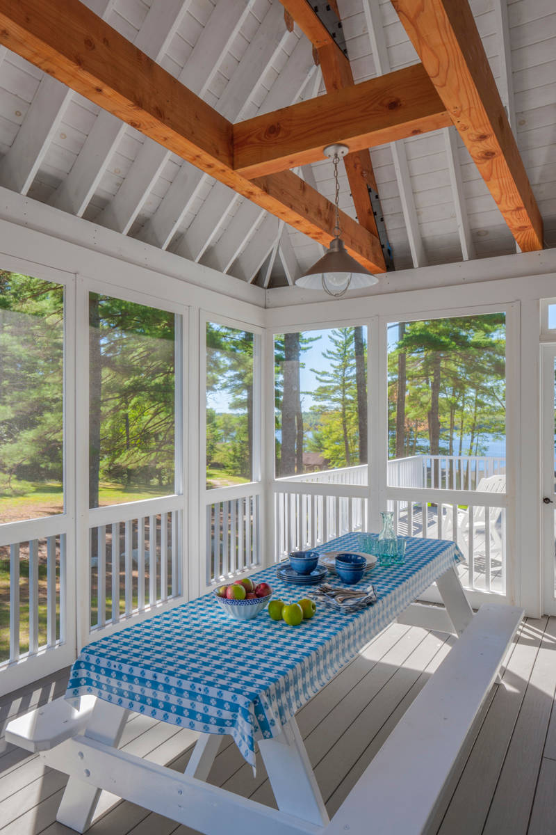 Farmhouse partial screened in porch picnic table