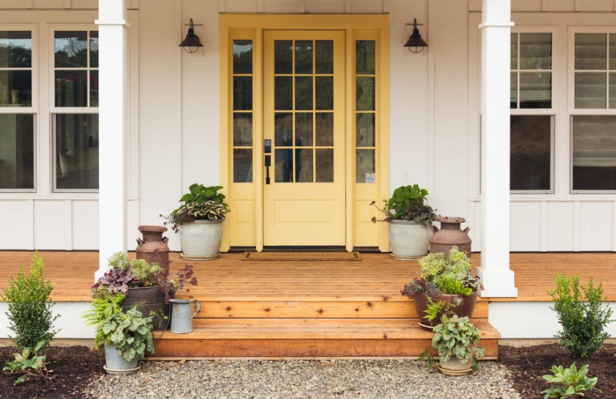 Farmhouse with a Soft Yellow Front Door