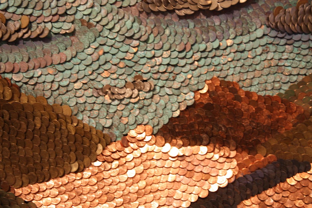 Uribe's piece consists of copper coins in various states of age and patina.