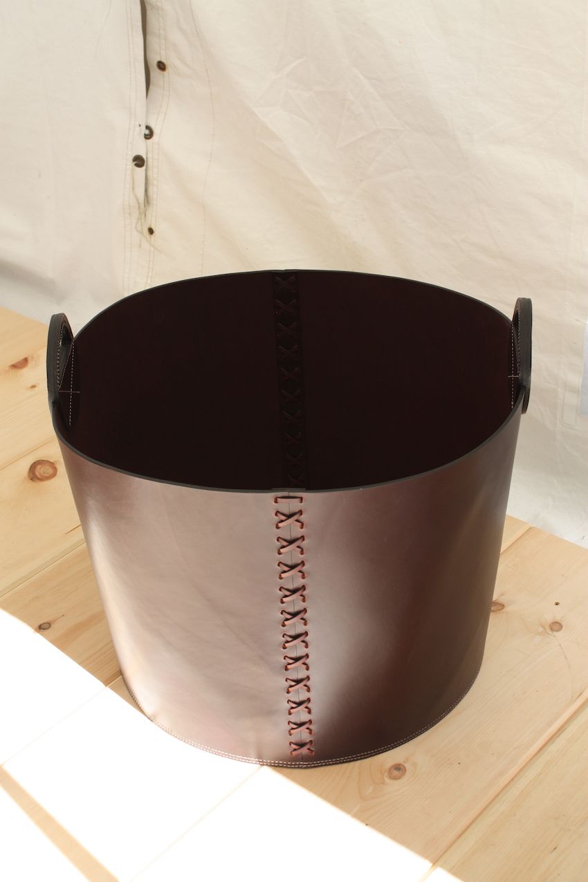 A hand stitched leather basket is a handsome and durable accessory.