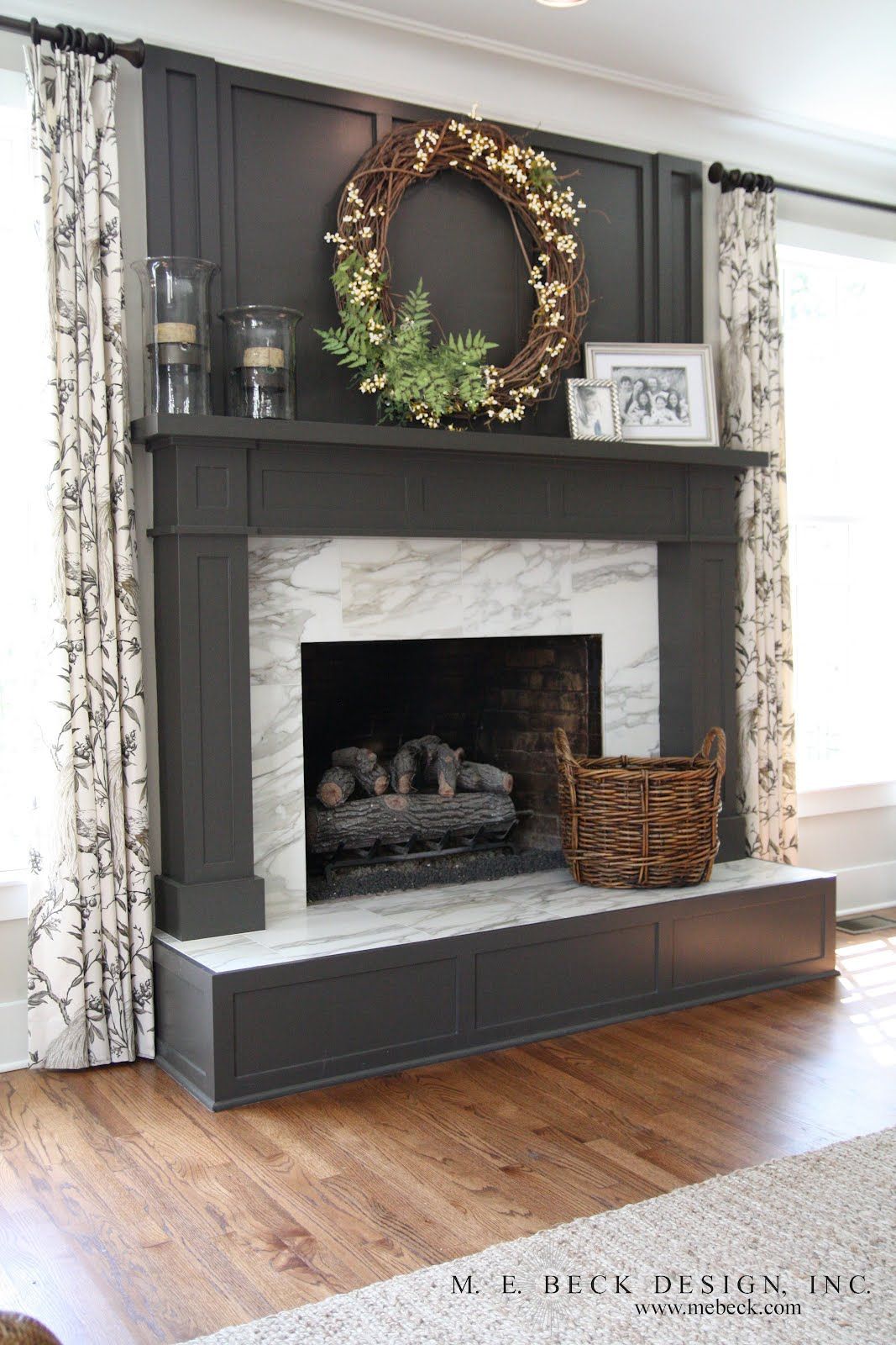 Fireplace mantel decorated with a big wreath