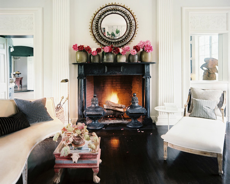 Black fireplace design with empty frames on mantel