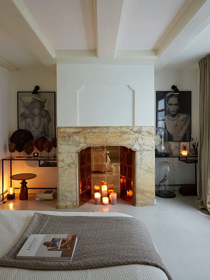 Fireplace with cream marble and candles placed inside