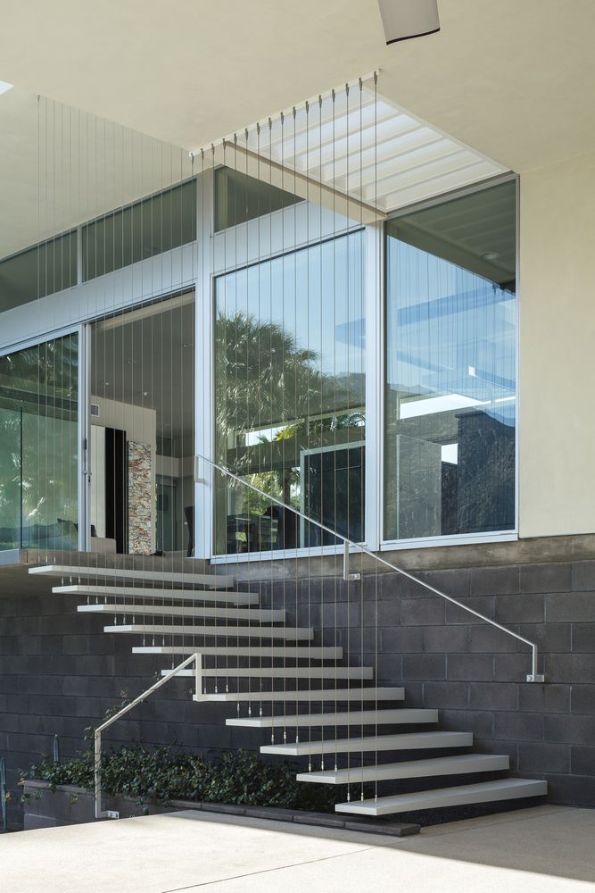 Floating stairs and hanging cords to create a staircase