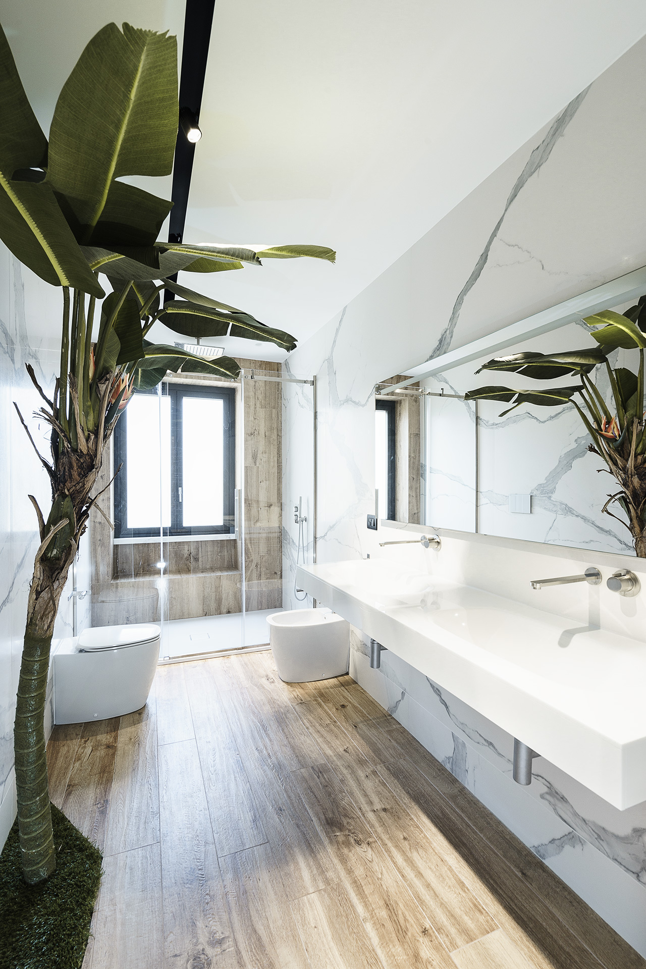 The floating vanity contributes to the roominess of the bathroom.