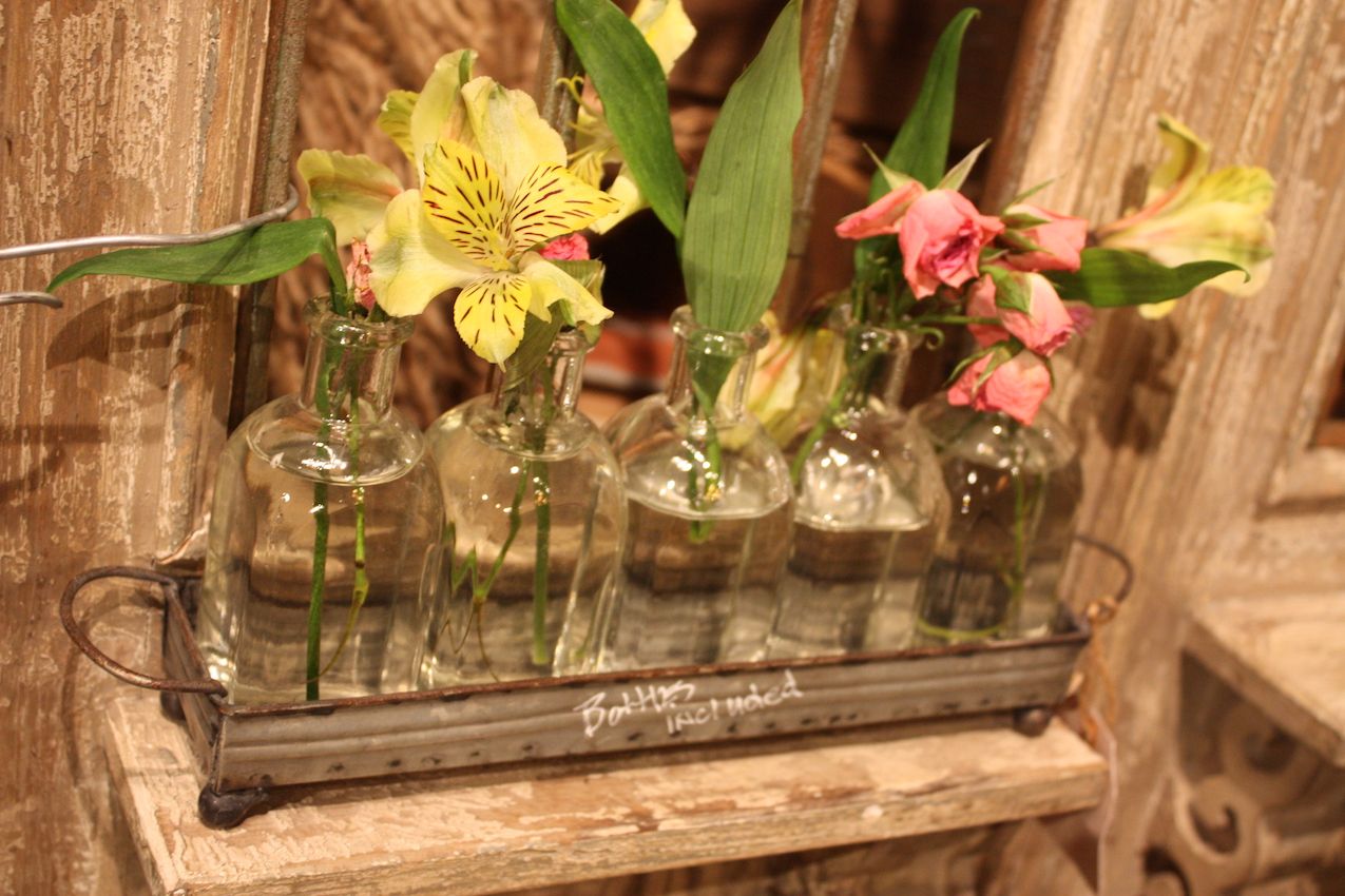 With flowers, the galvanized metal tray and small bottles are super cute.