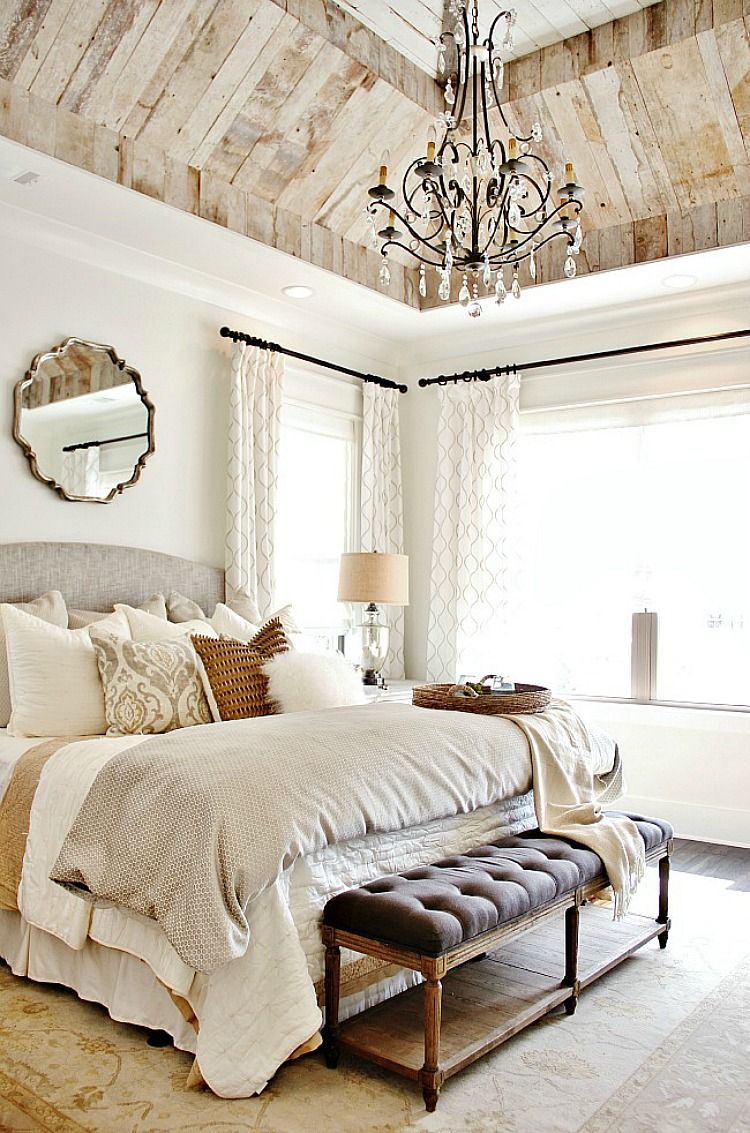 French country linens tufted furniture with mirror above headboard