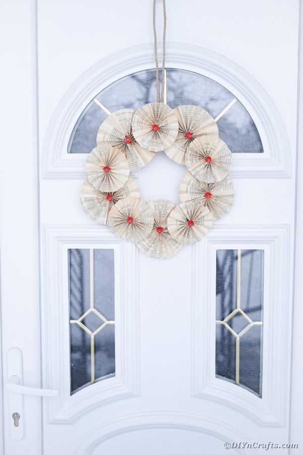 Front door book page wreath