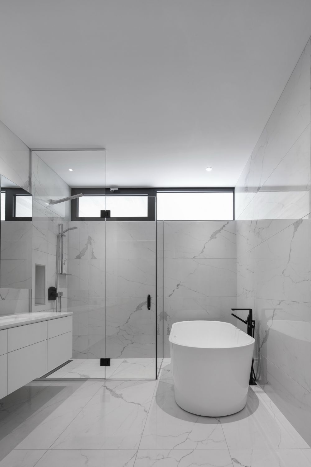 Full marble walk in shower and bathroom