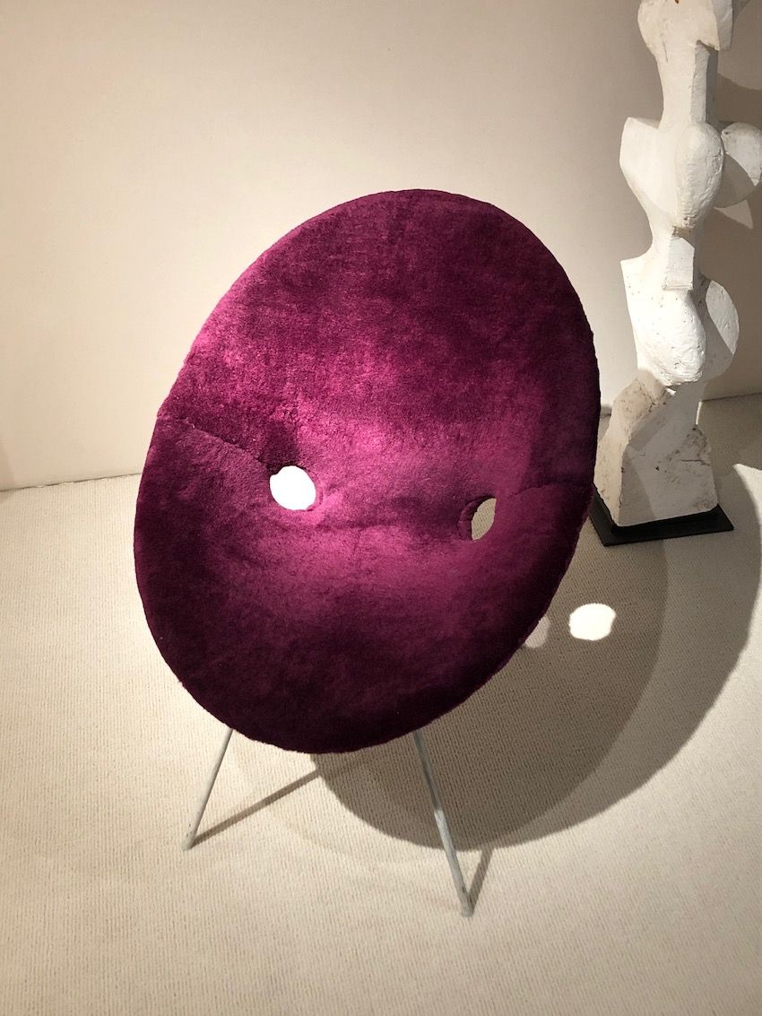 The shape and color of this Eddie Harlis chair add to its fun nature.