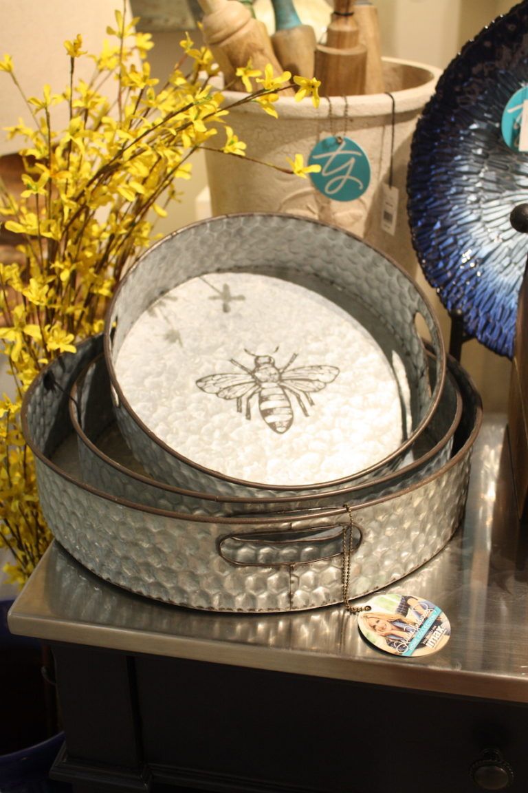 Galvanized metal trays from IMAX are part of the Trisha Yearwood Collection and feature a bee motif.