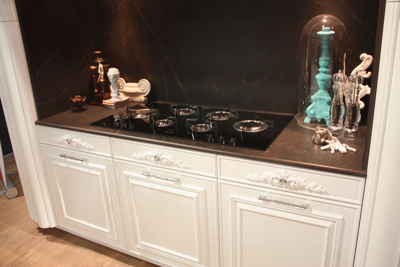 Backplates can be very ornate and add oomph to a smaller knob as in this Gatto kitchen.