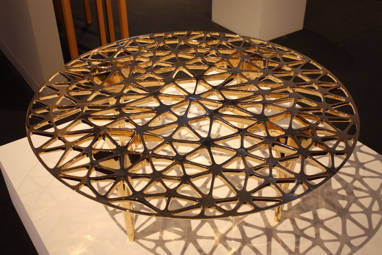 Again focusing on geometric lines, designer Janne Kyttanen created this magnificent polished bronze tabletop. Finnish artist Kyttanen is a "digital sculptor creating multidisciplinary work at the intersection of 3D printing, virtual & augmented reality."