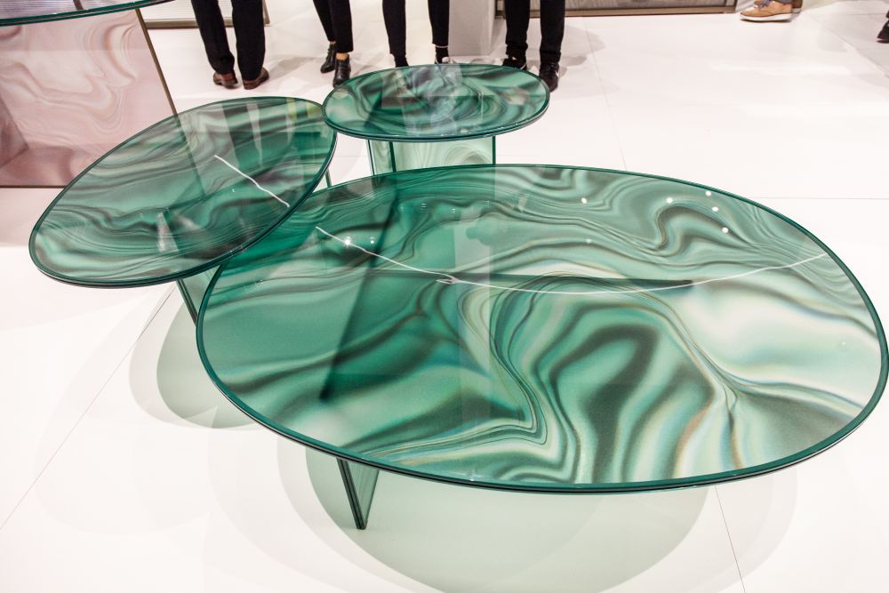 The Liquefy coffee tables are made entirely of glass and their tops mimic the look of marble