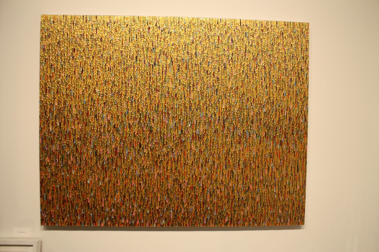 This large work also relies on precision for the thousands of gold and colored drips.