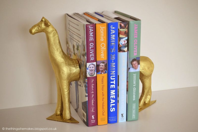 Gold giraffe bookends