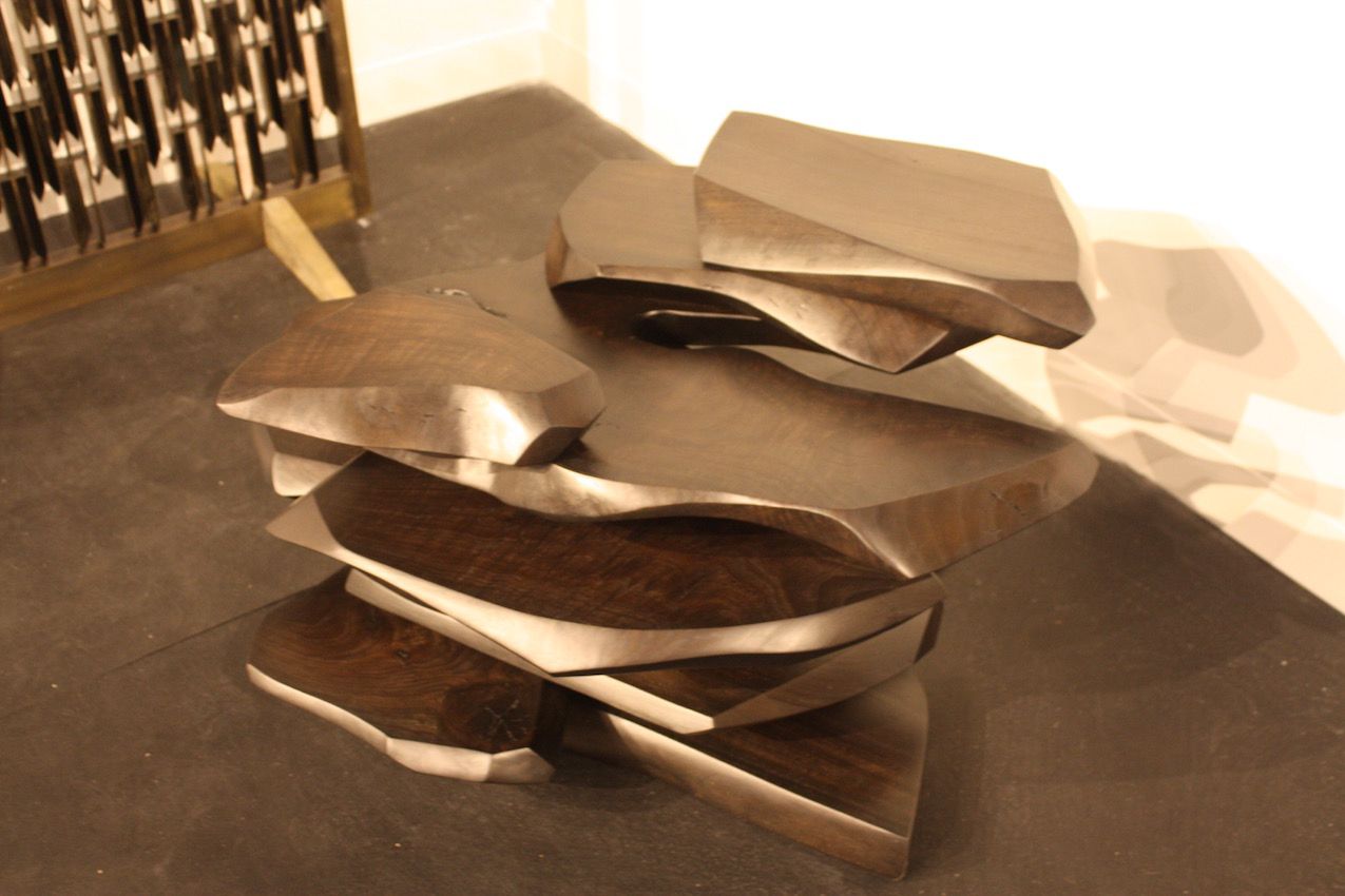 While it might look metallic, this stacked side table, by artist Stephen Bishop is made of walnut. It is available at the Cristina Grajales Gallery.