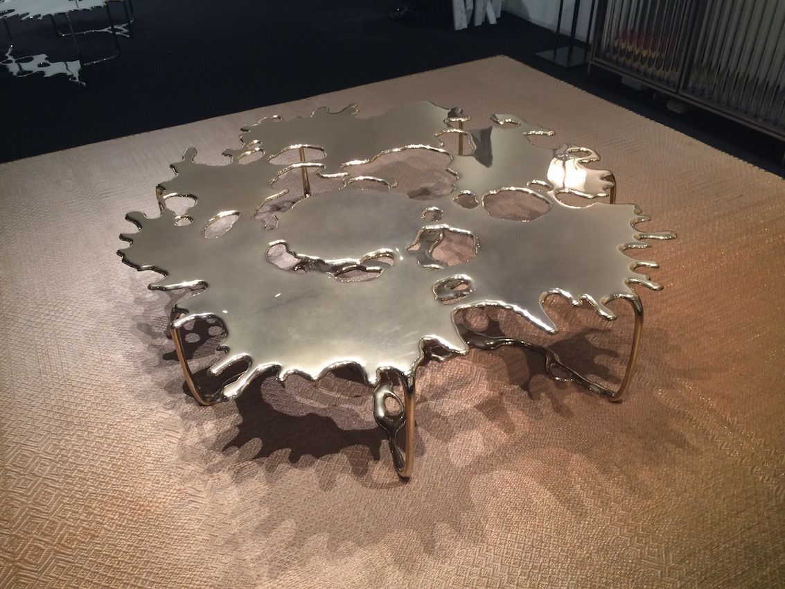 Created in bronze, this coffee table would be the focal point in any interior design.