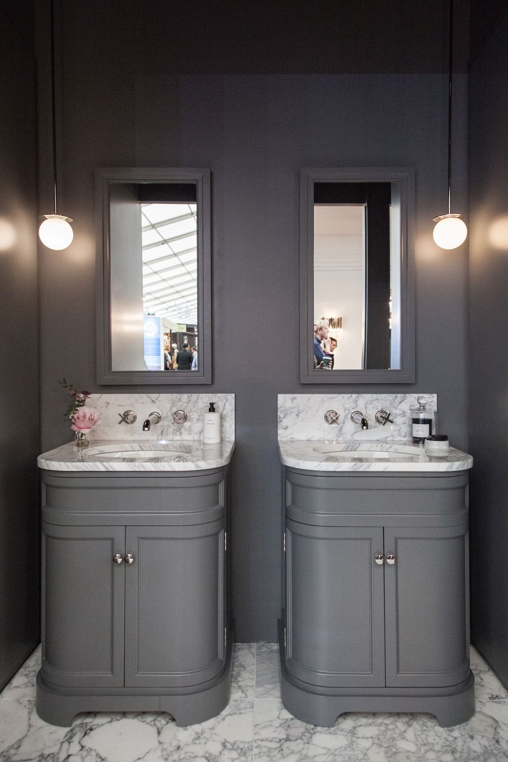 Gray bathroom interior design with marble sink and backsplash