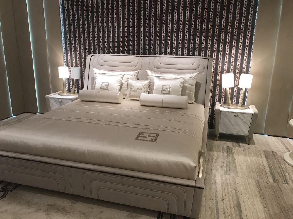 Gray bedroom bed with marble small nighstands