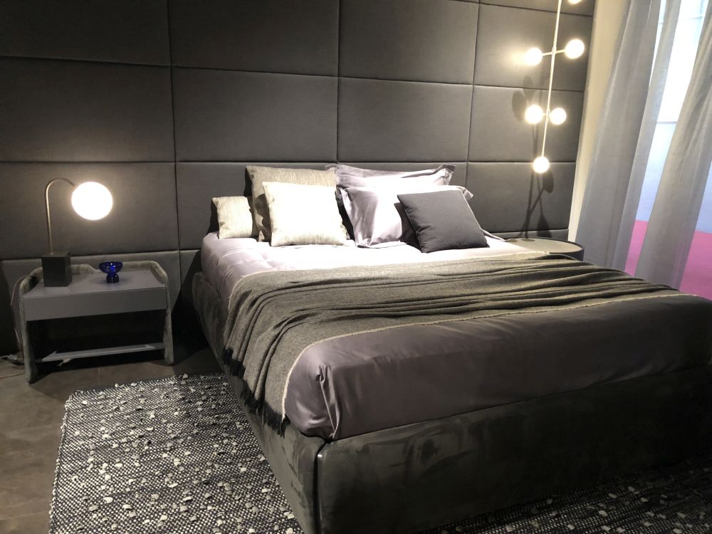 Gray geometric floor to ceiling headboard