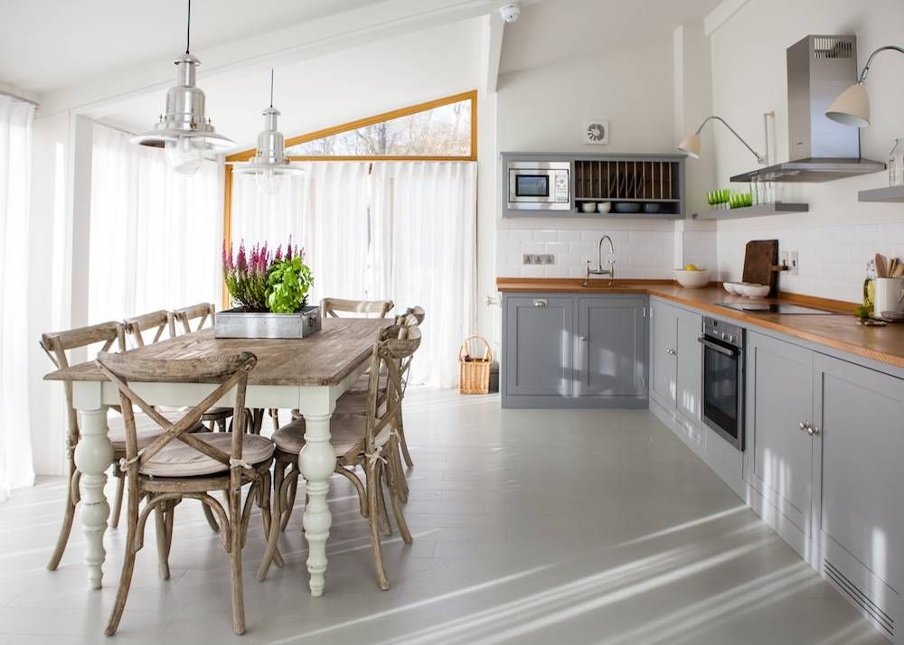 Gray kitchen cabinets with farmhouse table