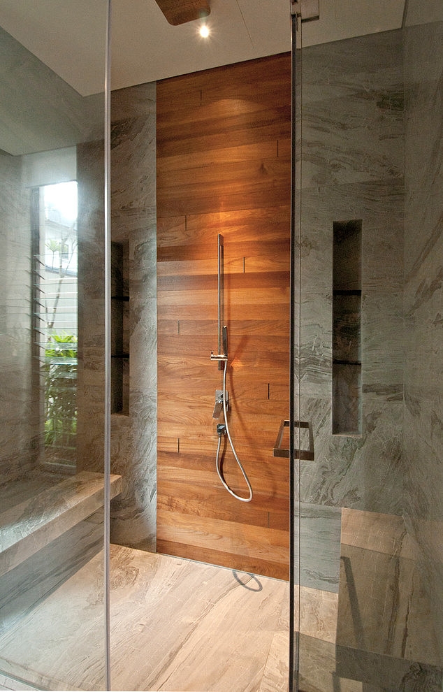 Gray shower tiles with wood accents