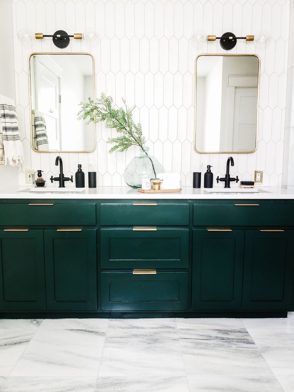 Green cabinets and modern white tiles