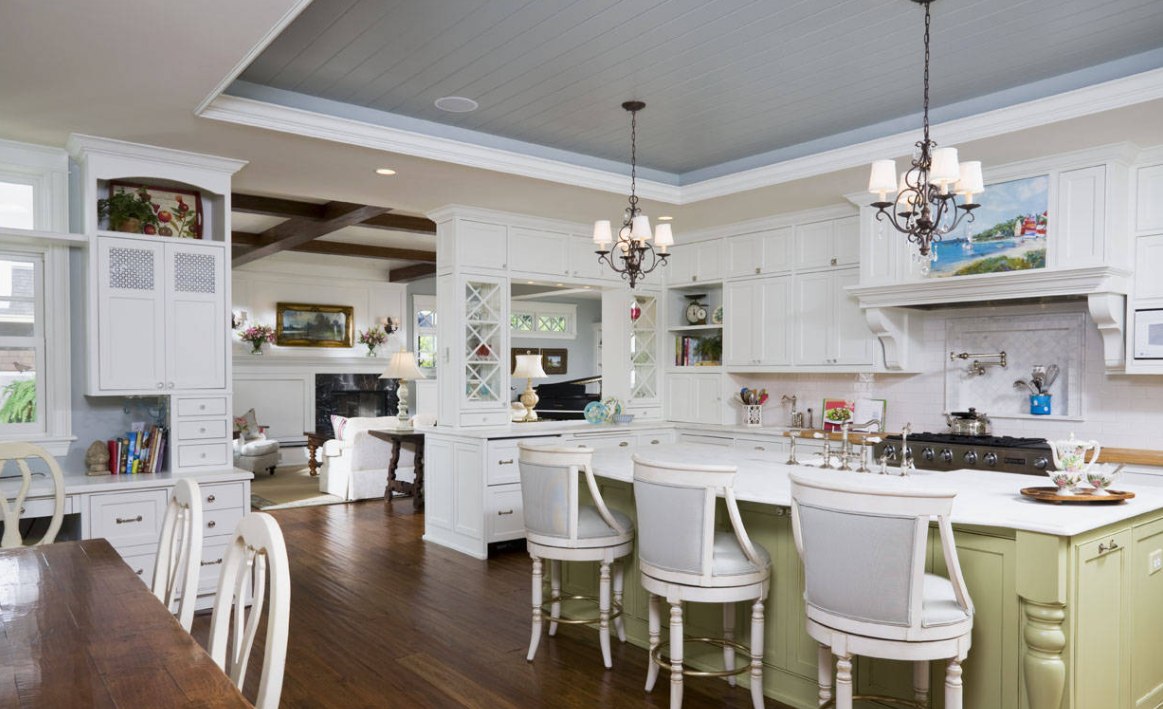 Green kitchen island hardwood floor and grey beadboard ceiling