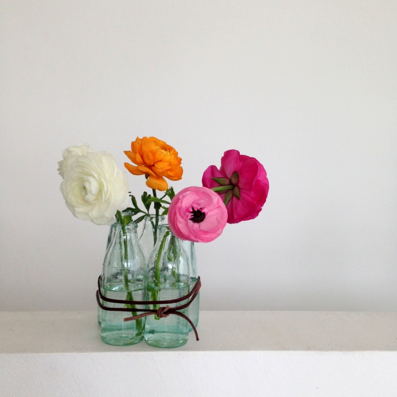 Gruping glass bottle to create flower vases