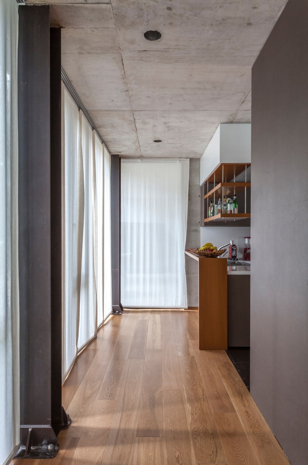 The hall to the kitchen offers a look at the various design details.