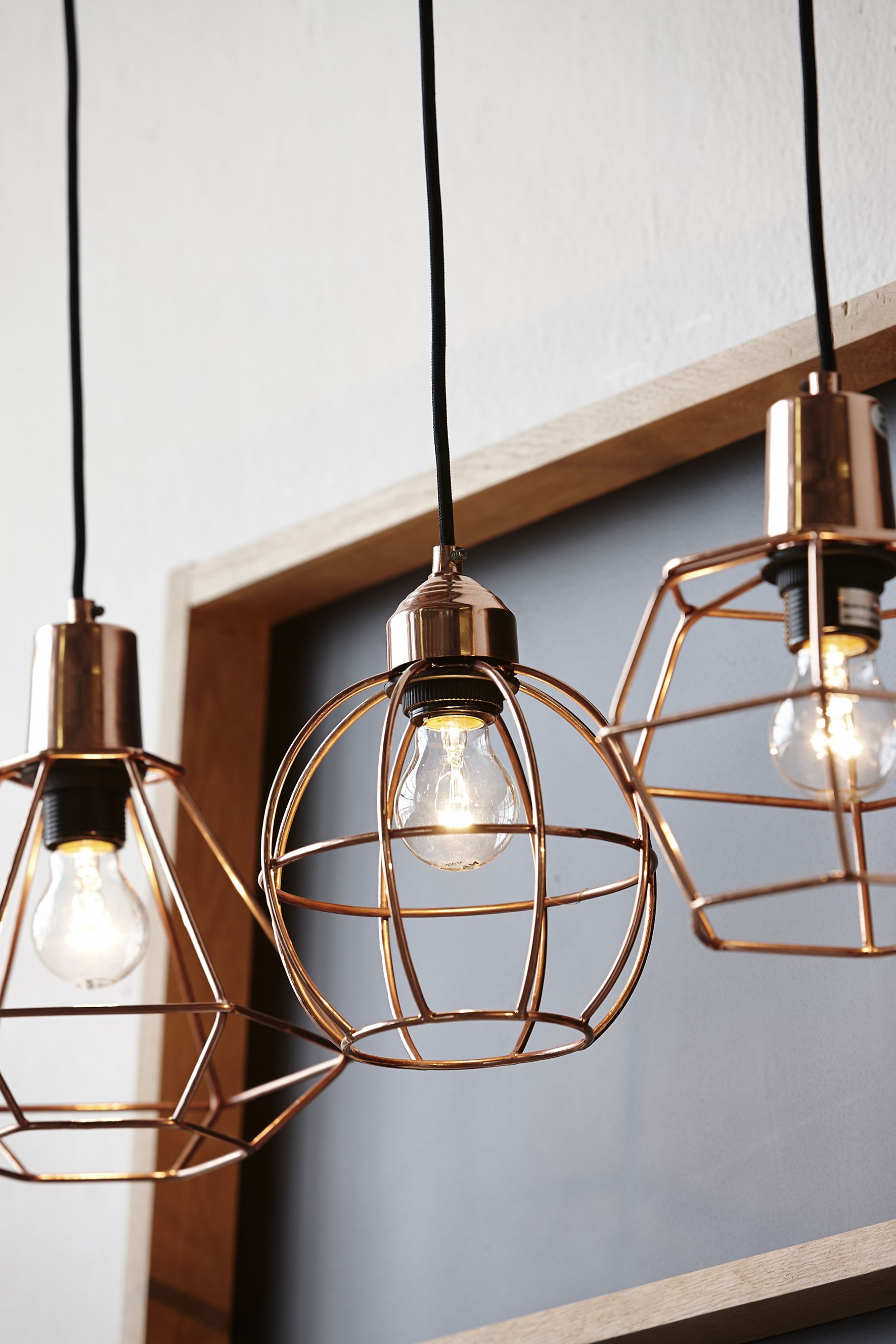 Hanging copper cage lights