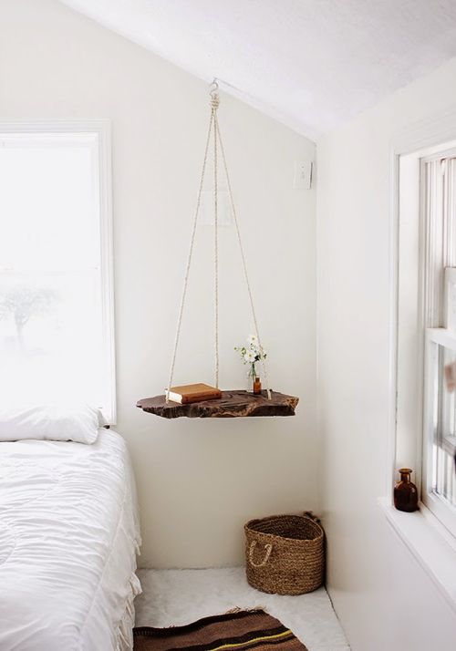 Hanging wood shelf used like nightstand