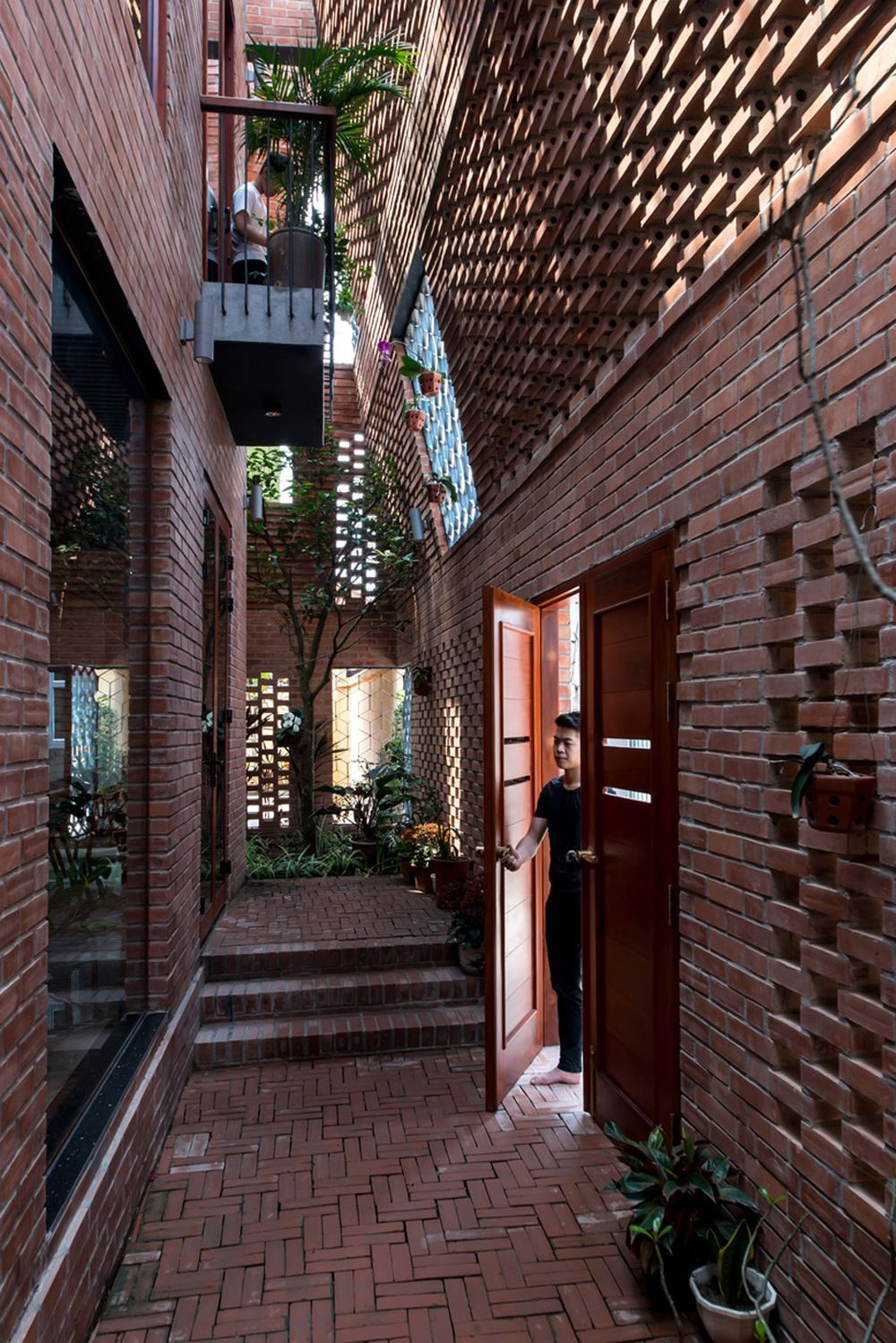 Hanoi perforated brick facade by Vietnamese studio H&P Architects - entryway