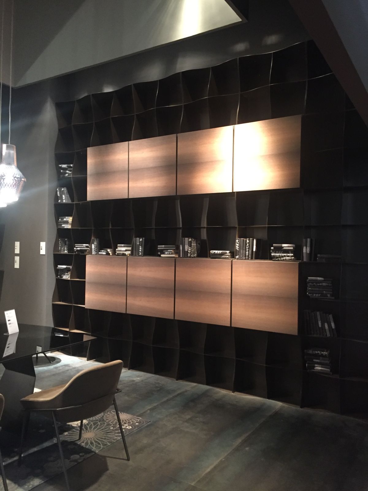 High ceiling home library with curved shelves and partitions