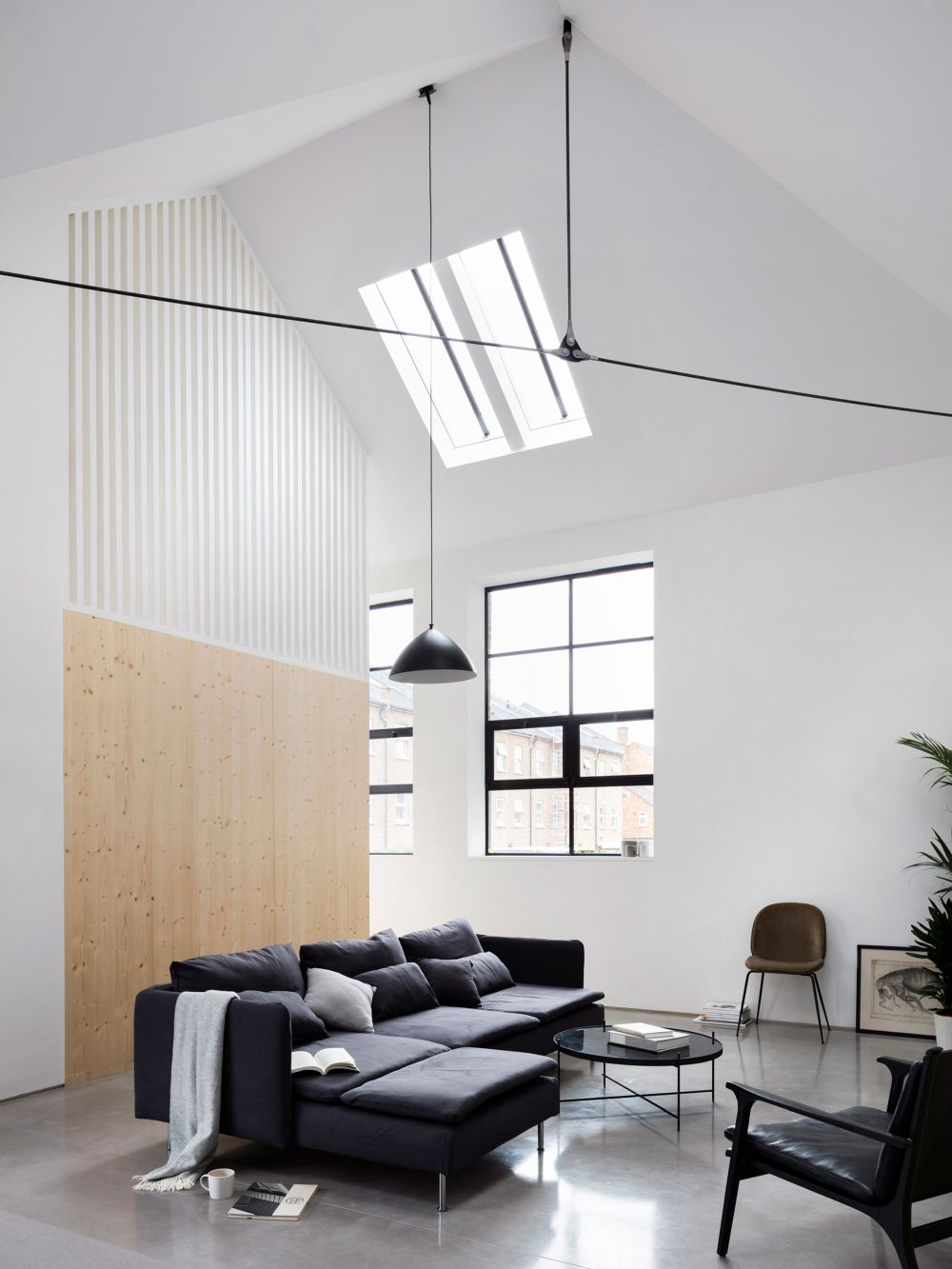 High ceilings Former warehouse into home by Paper House Project