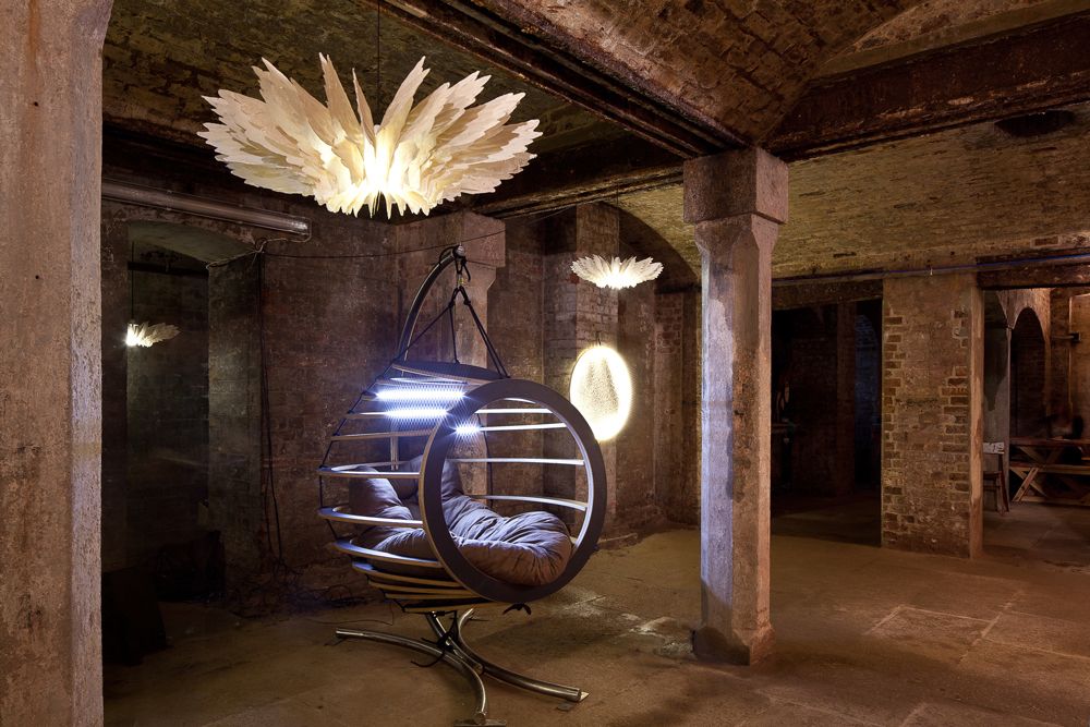 The Hive chair paired with paper winged chandeliers from Daniel Latorre Cruz.