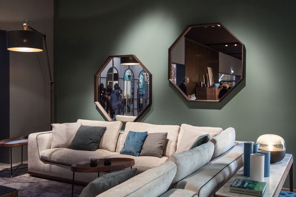 Honeycomb shpage mirrors on the wall above the sofa