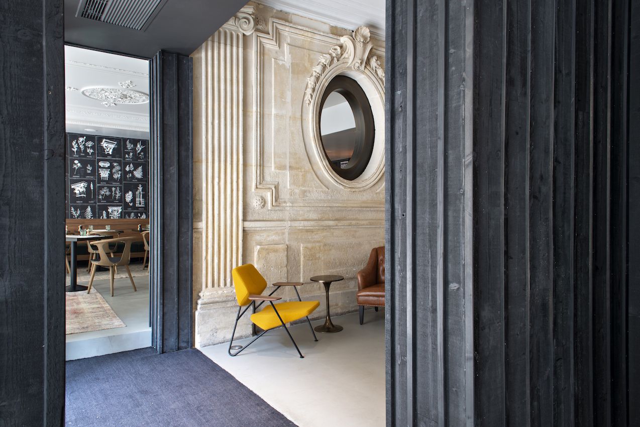 Rustic wood doorways contrast with the other elements.