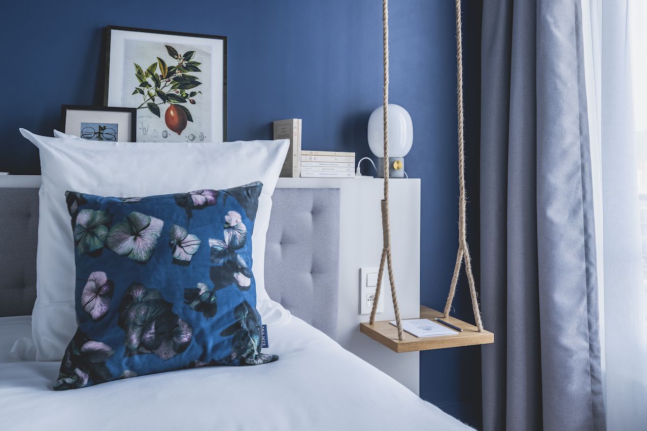 Funky pieces like the swing nightstand are unlike other standard hotel decor items.