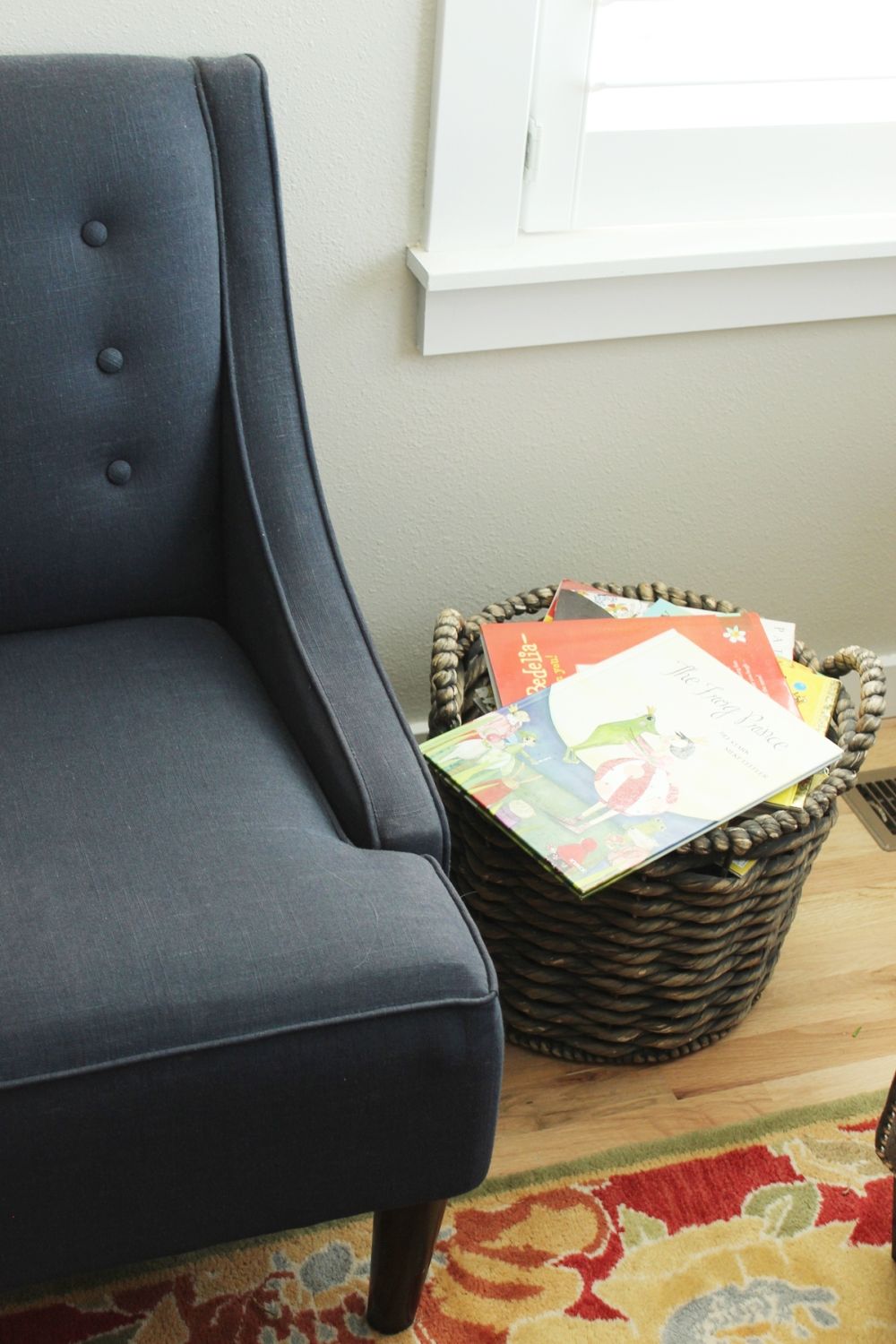 How to Decorate Living Room - tufted chair and rattan storage basket