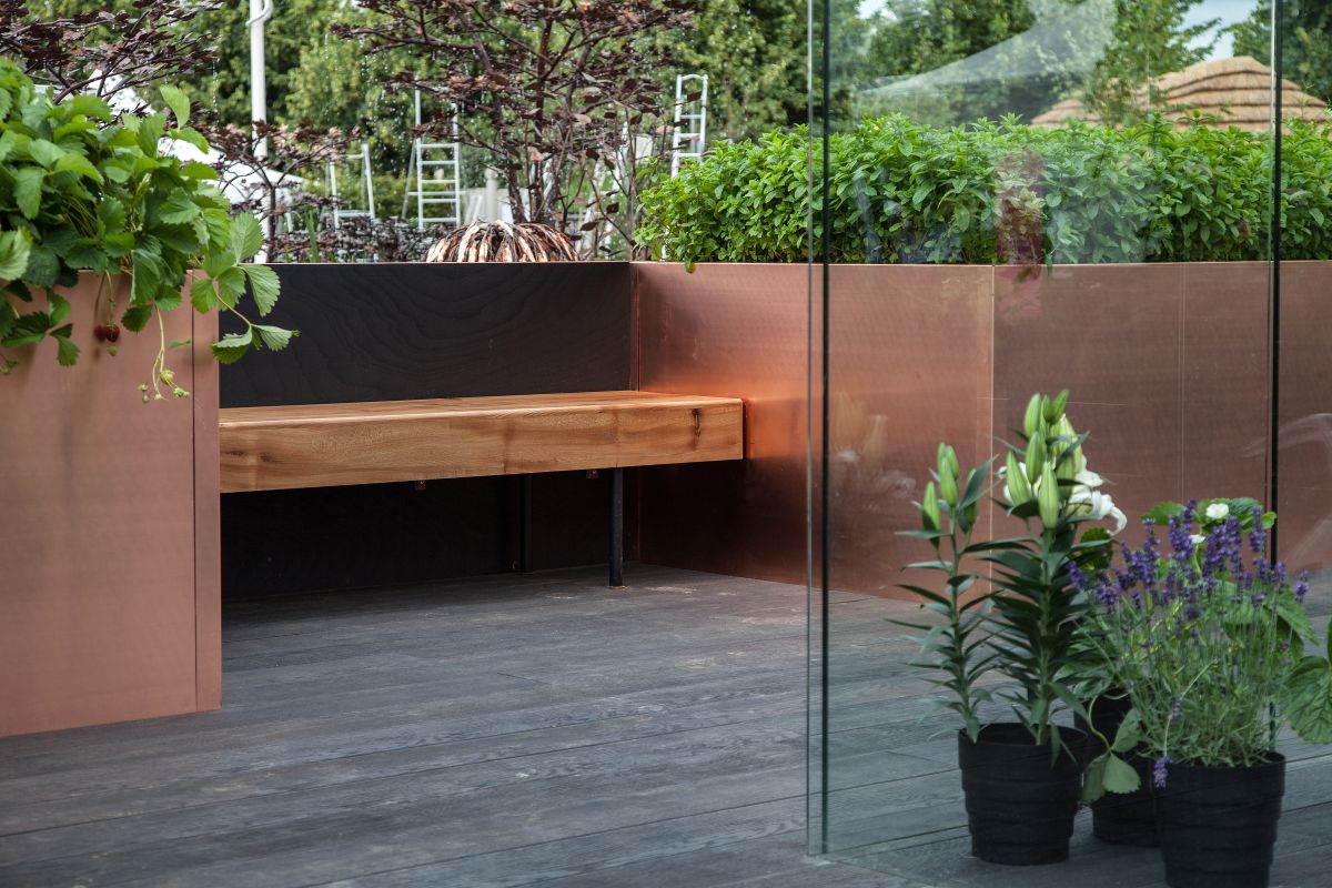 If you prefer a bit of privacy, the bench can be placed in a nook or can be framed by large planters