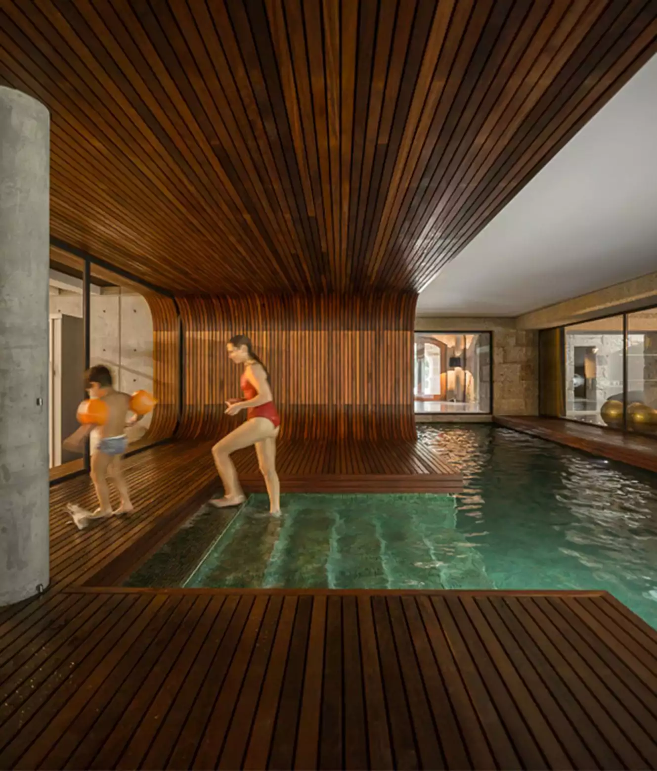 Indoor swimming pool with deck on the ceiling and floor