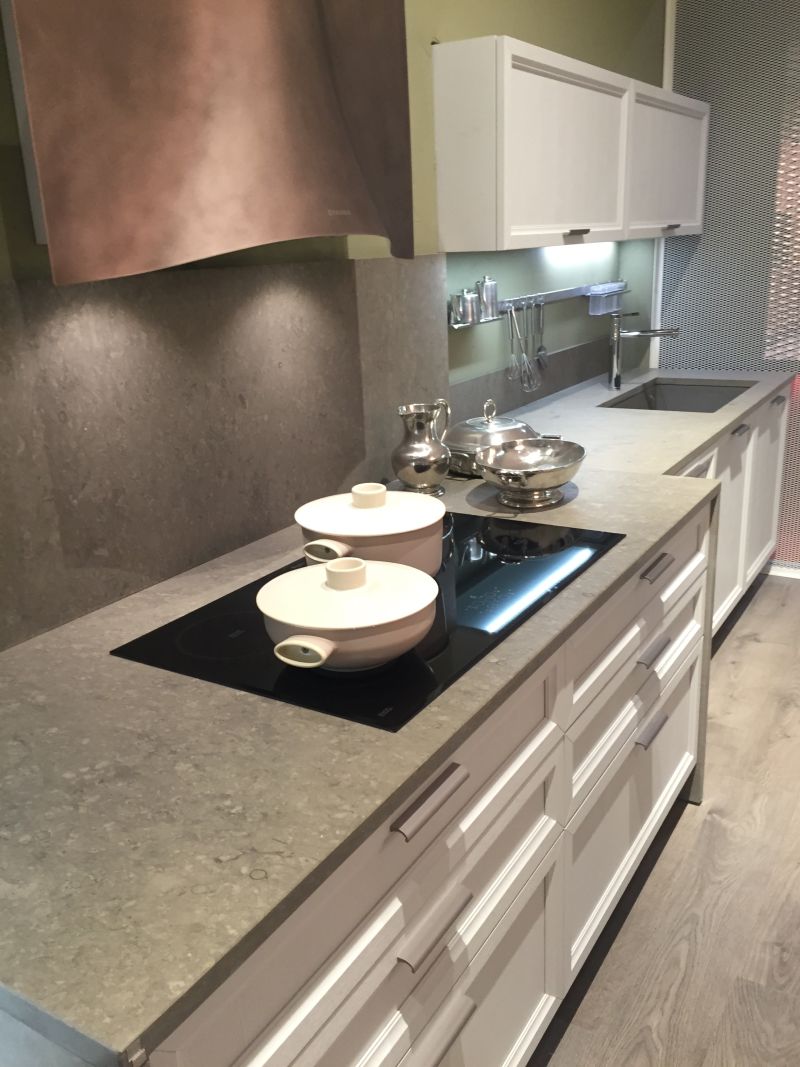 Induction cooktop and grey marble countertop - curverd hood