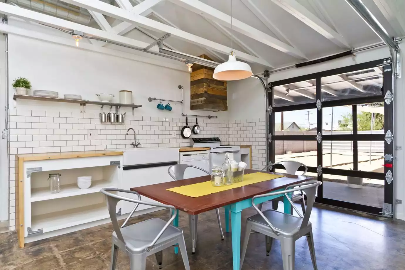 Industrial style simple kitchen with subway tiles in garage