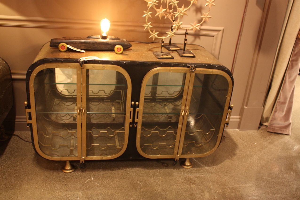 A number of unique elements make this console/wine storage cabinet a real conversation piece.