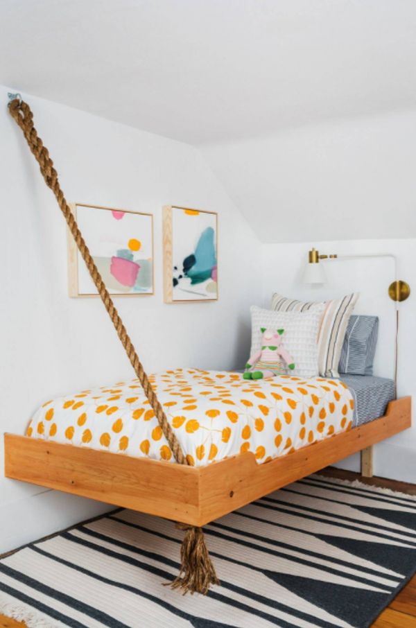 Inspiration for a coastal kids room remodel in Boston with white walls