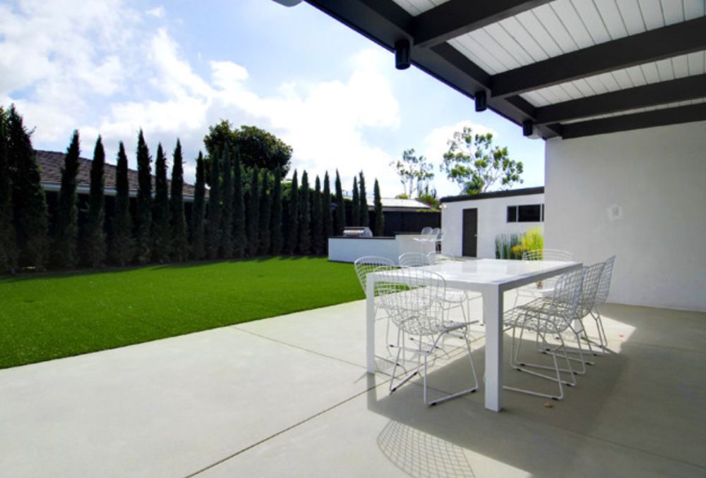 Inspiration for a large contemporary backyard landscaping