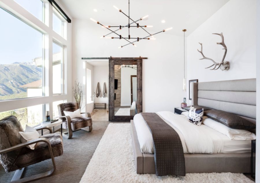 Inspiration for a rustic master carpeted bedroom remodel in Salt Lake City